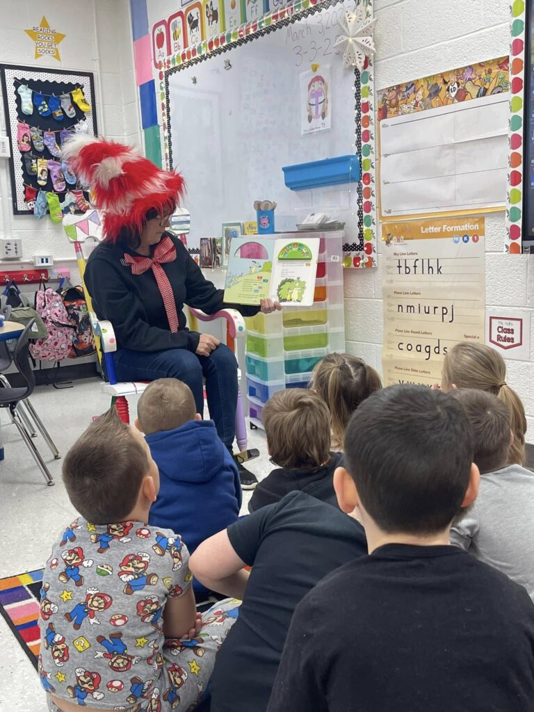 Turner reading to students at Hindman Elementary.