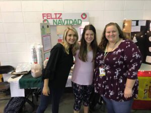 Holland pictured with two girls standing